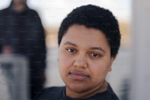 a close up of a person wearing a black shirt