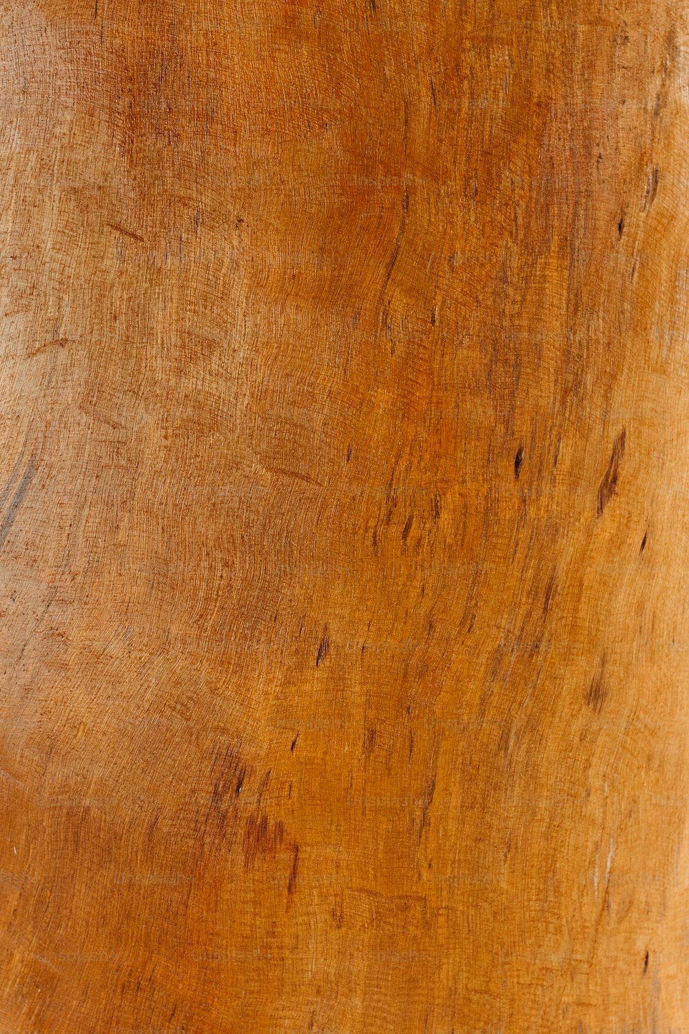 a close up of a wooden surface with scratches