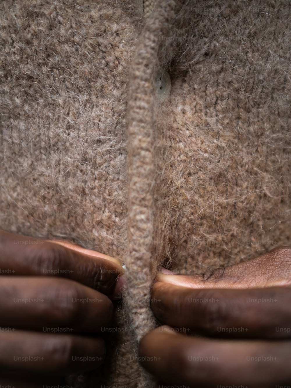 a close up of a person's hands holding something