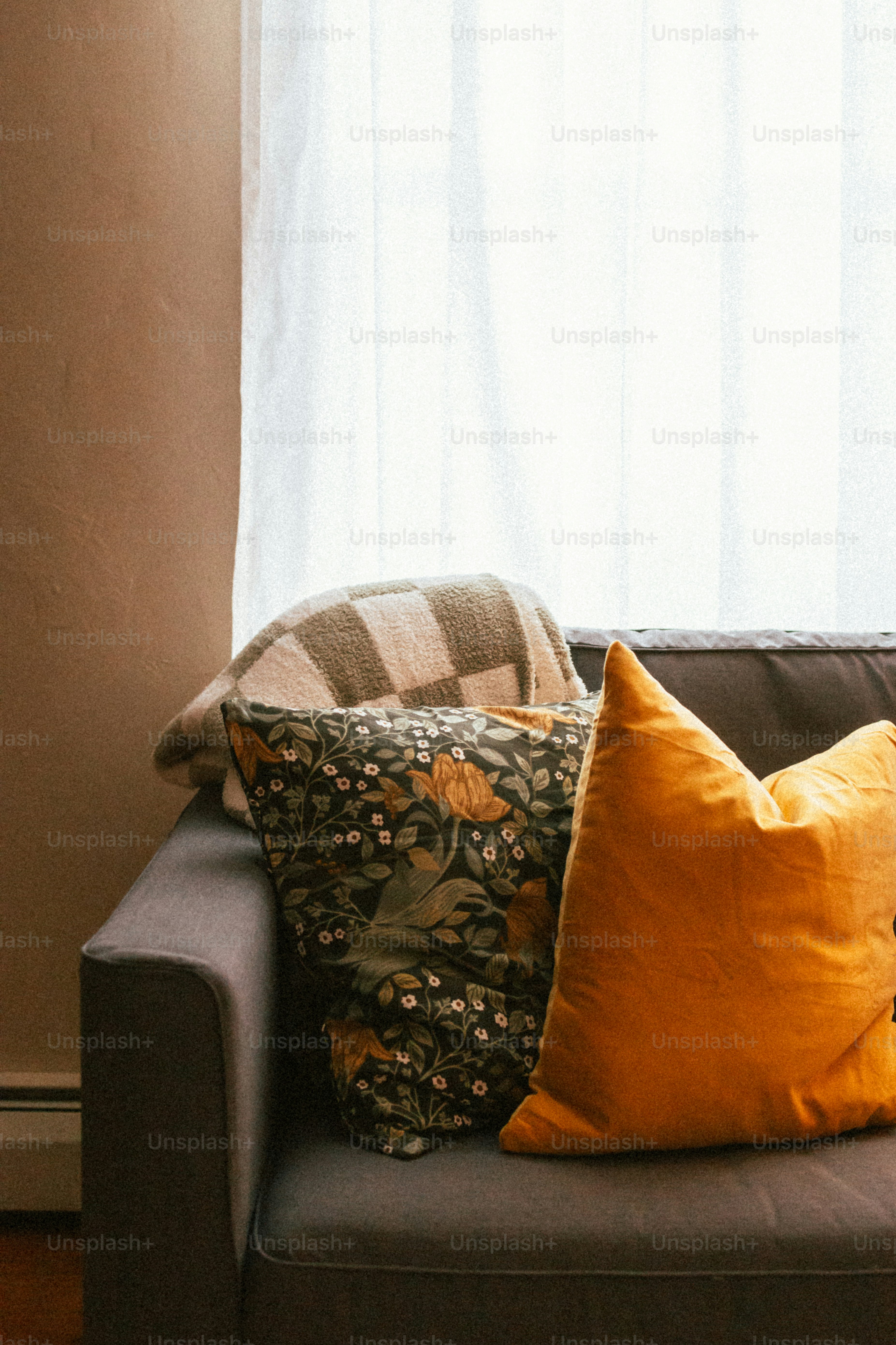 a couch with a bunch of pillows on top of it