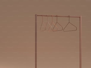 a clothes rack with three hangers on it