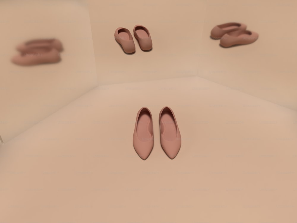 흰색 바닥 위에 앉아 있는 분홍색 신발 한 켤레