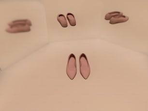 흰색 바닥 위에 앉아 있는 분홍색 신발 한 켤레