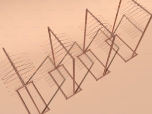 a group of metal racks with a pink background