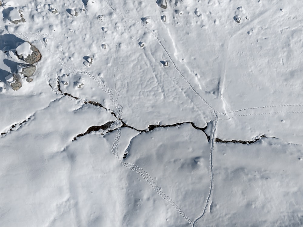 an aerial view of a snow covered area