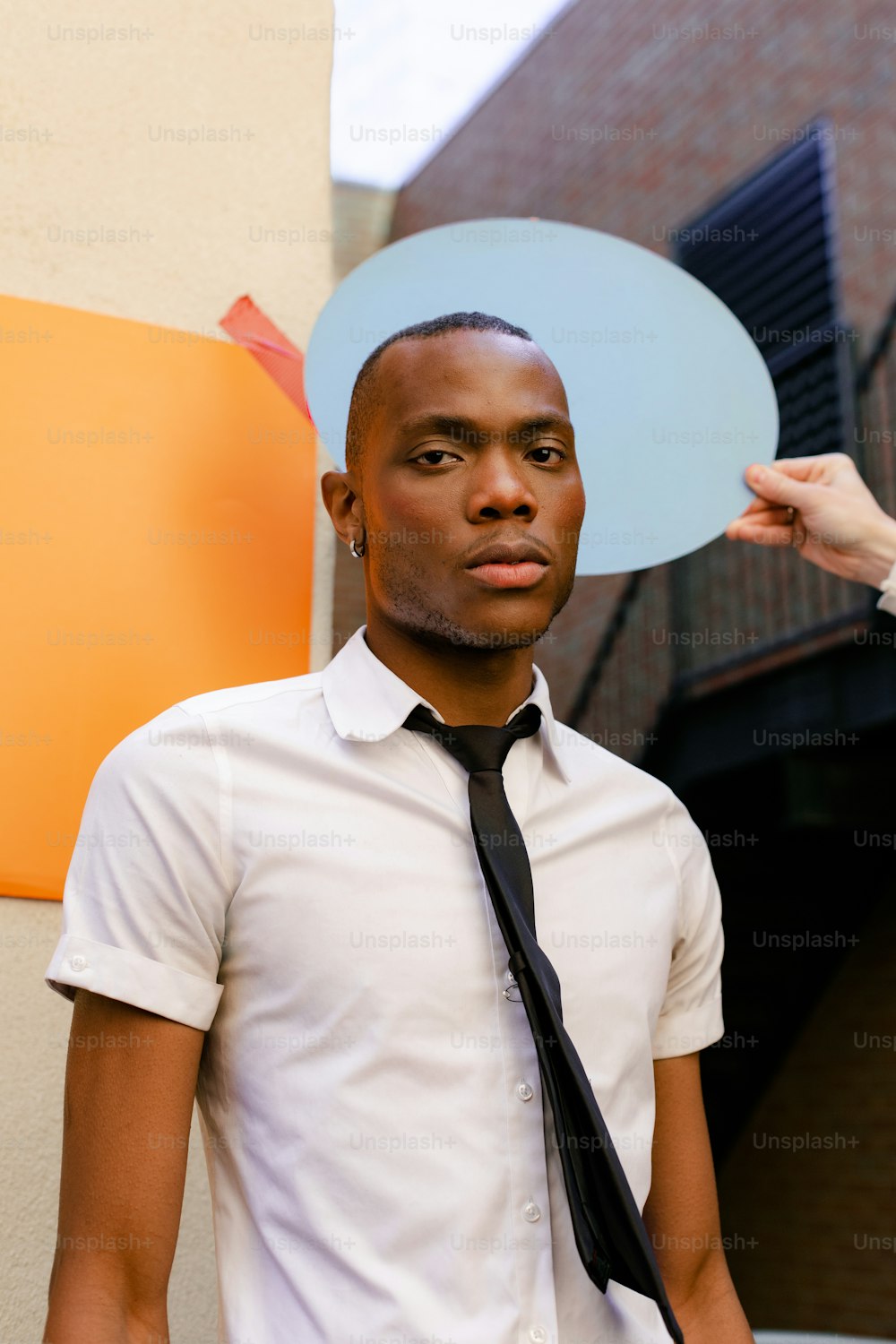 a man wearing a tie and a white shirt