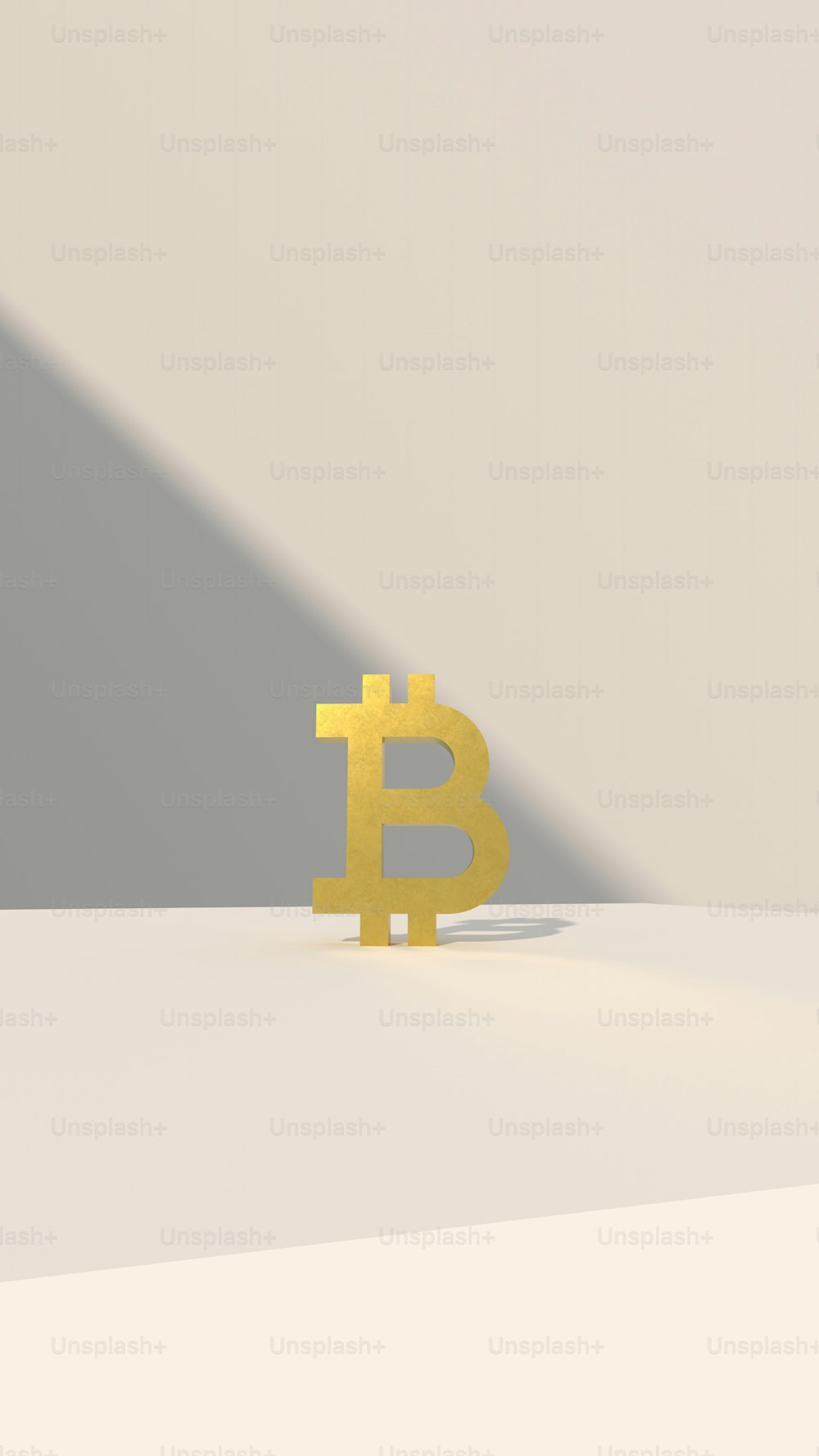 a yellow bit coin sitting on top of a table