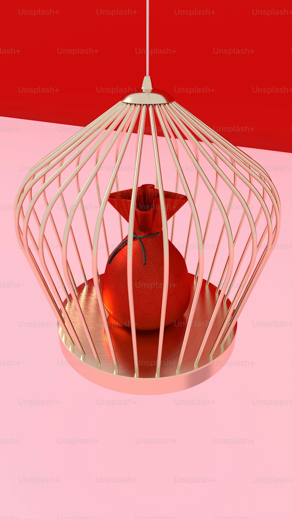 Un pájaro en una jaula sobre una superficie rosada