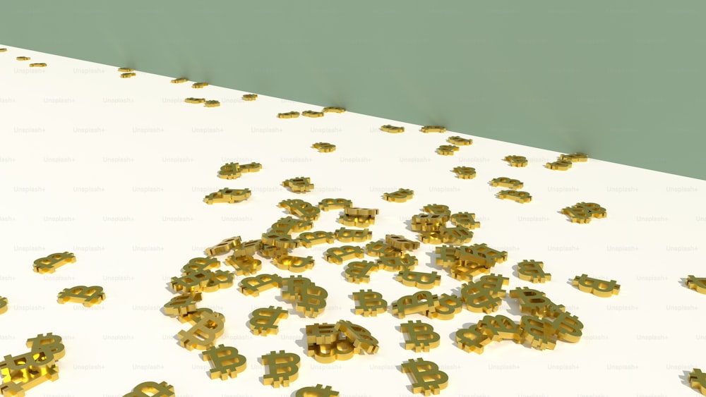 a bunch of gold nuggets on a white surface
