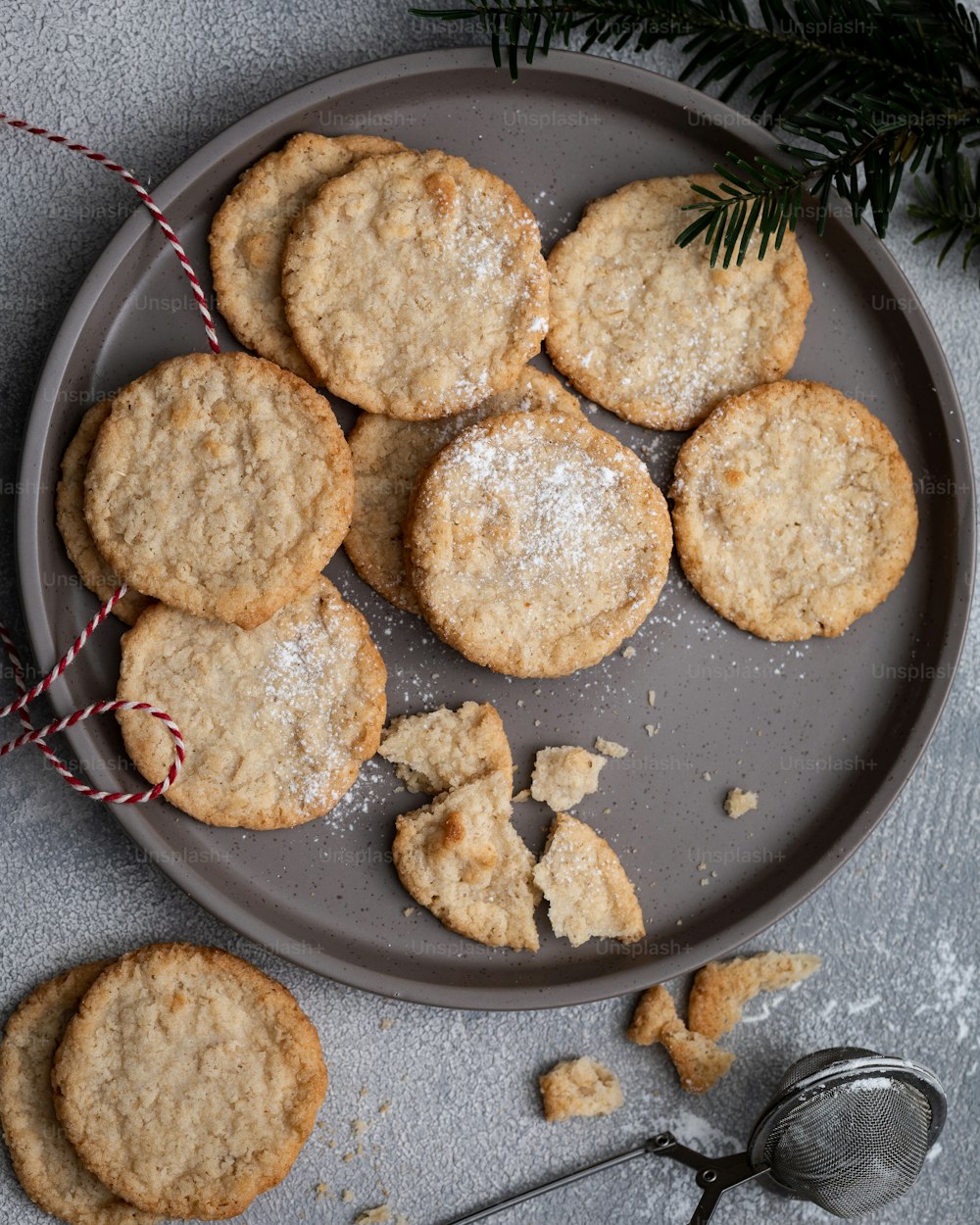 a plate of cookies and a spoon on a table