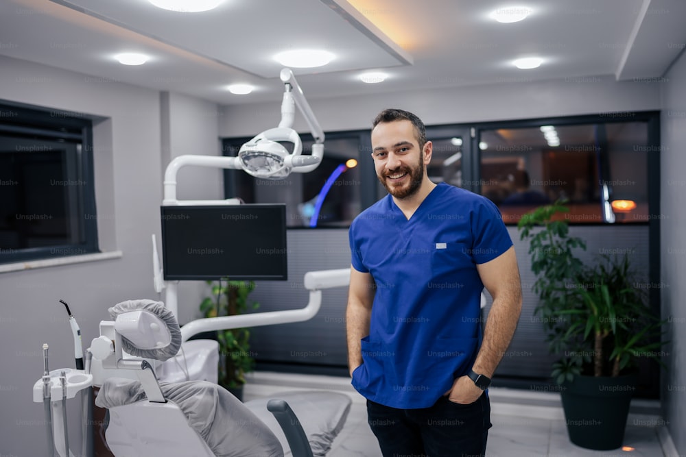 a man standing in front of a dental chair
