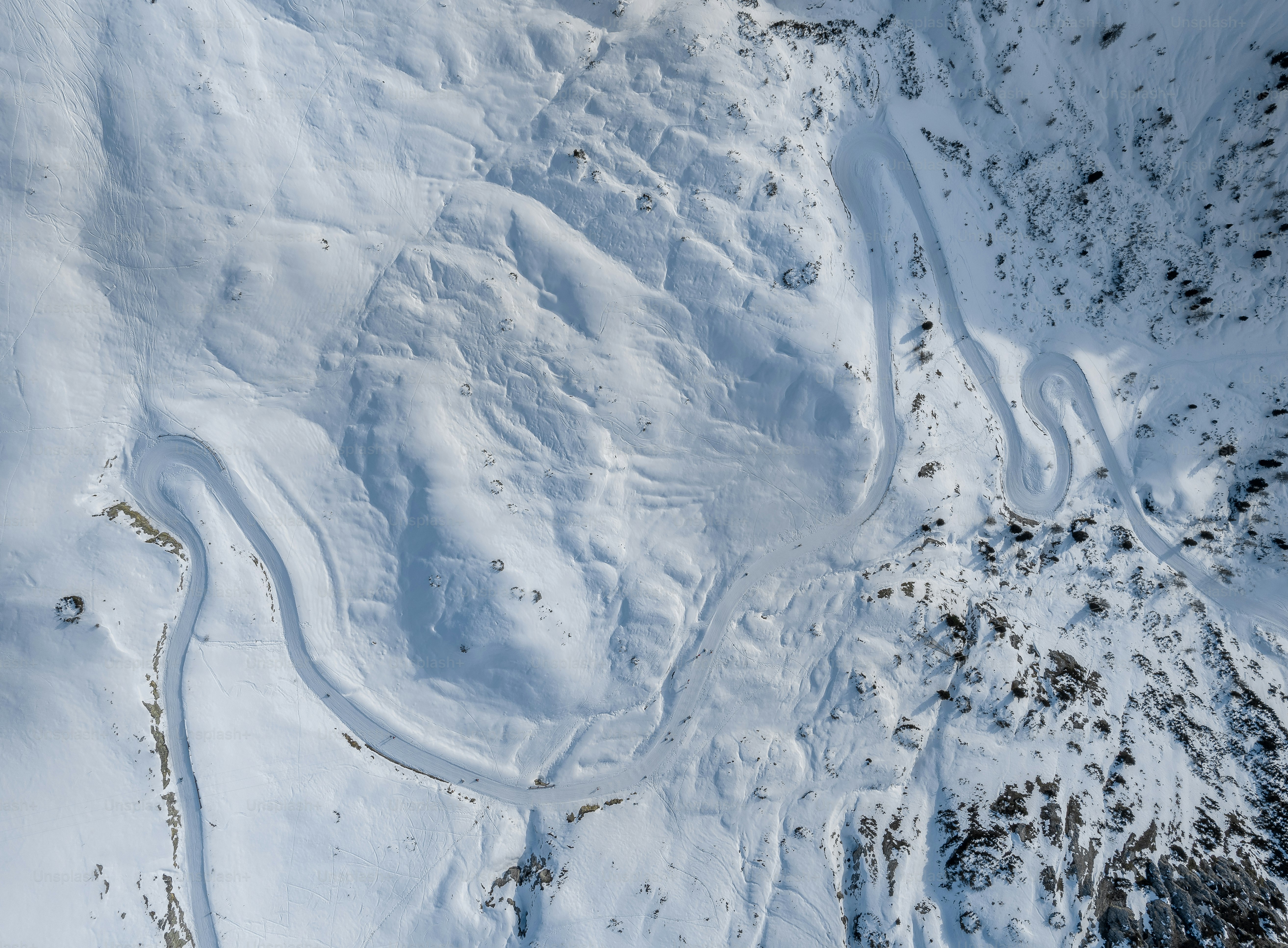 An aerial view of a snow covered mountain photo – Winter Image on Unsplash