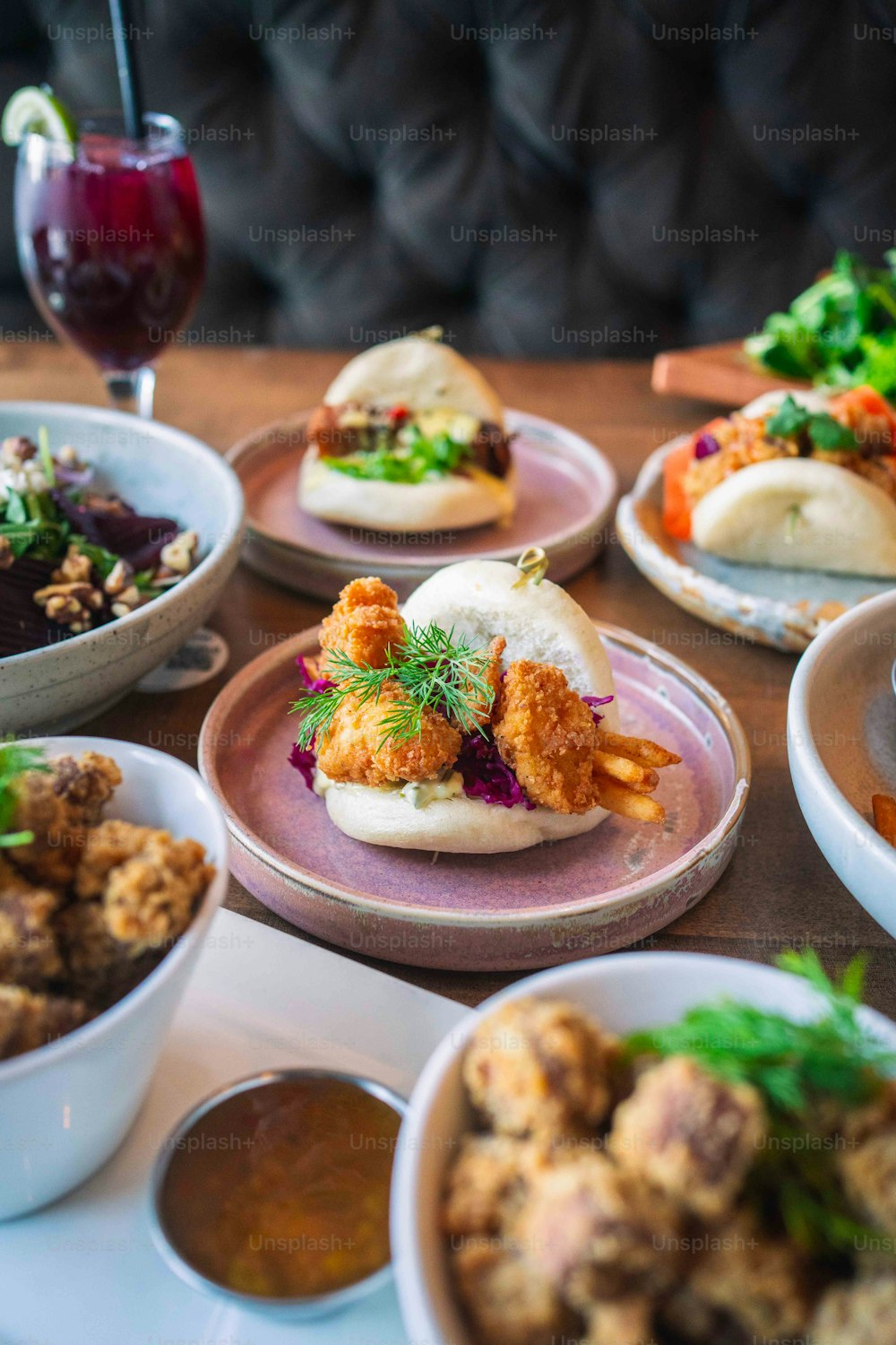 a table topped with lots of plates of food