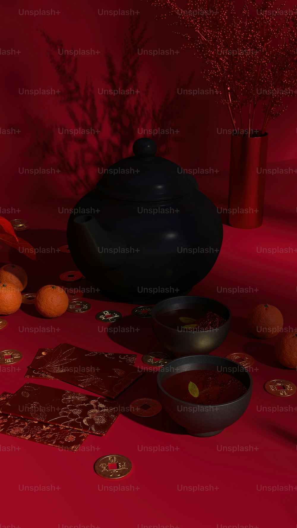 Eine schwarze Teekanne sitzt auf einem roten Tisch