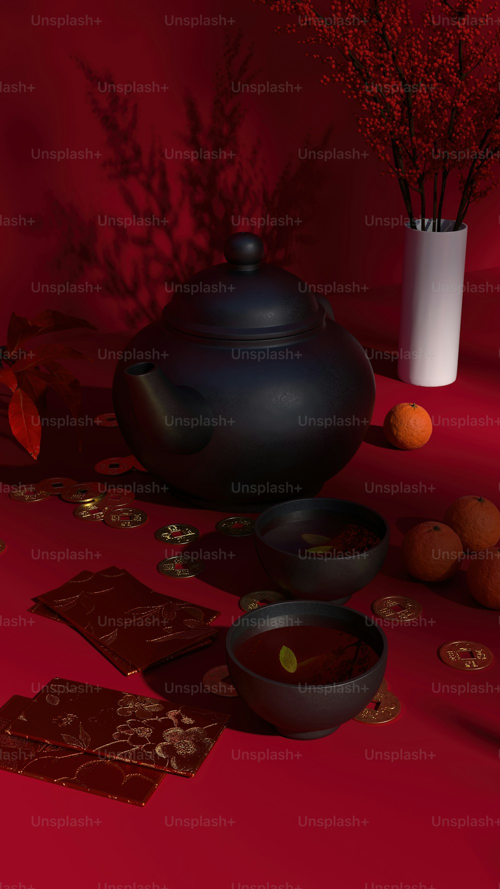 Eine schwarze Teekanne sitzt auf einem roten Tisch