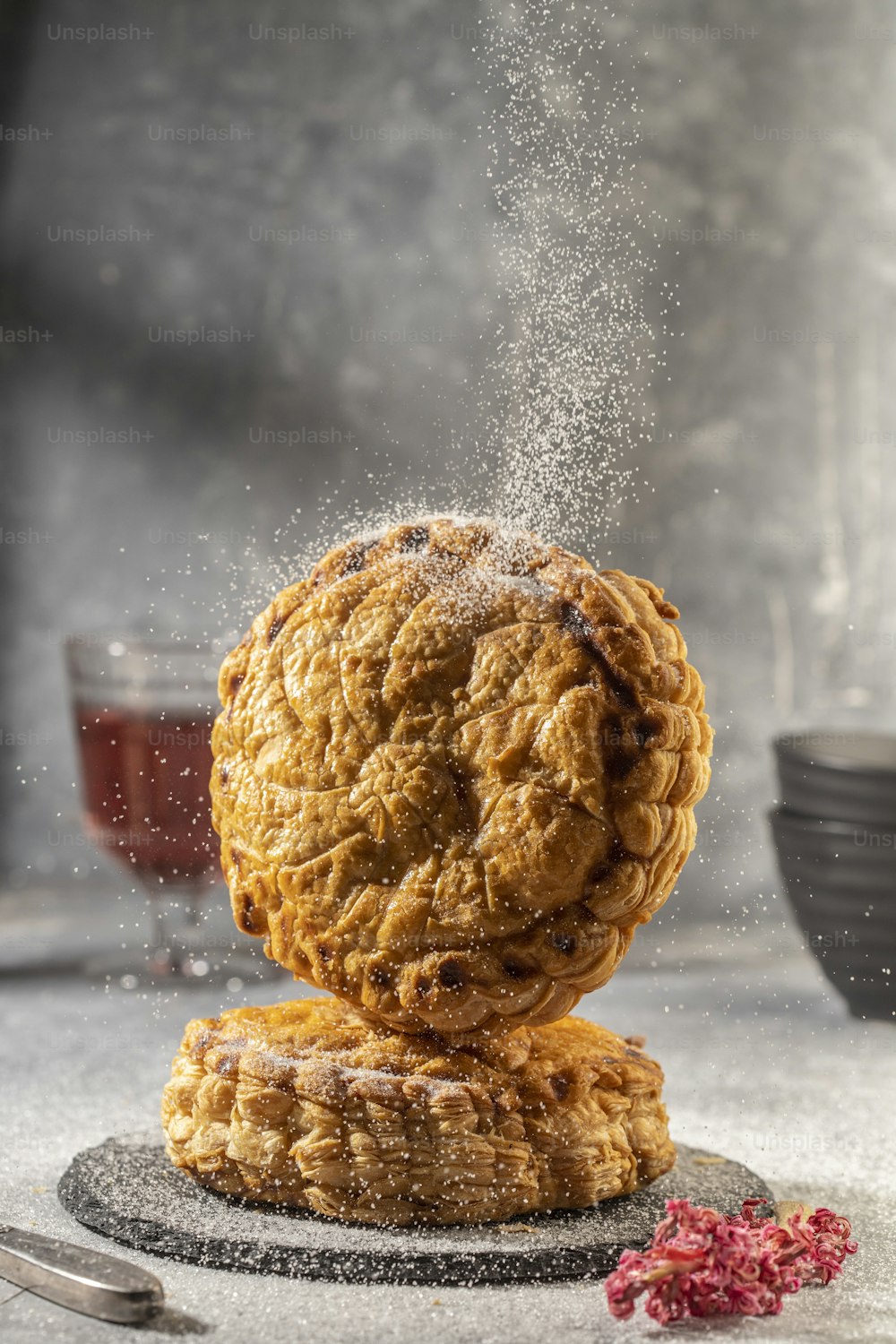 a stack of three pastries on top of a plate