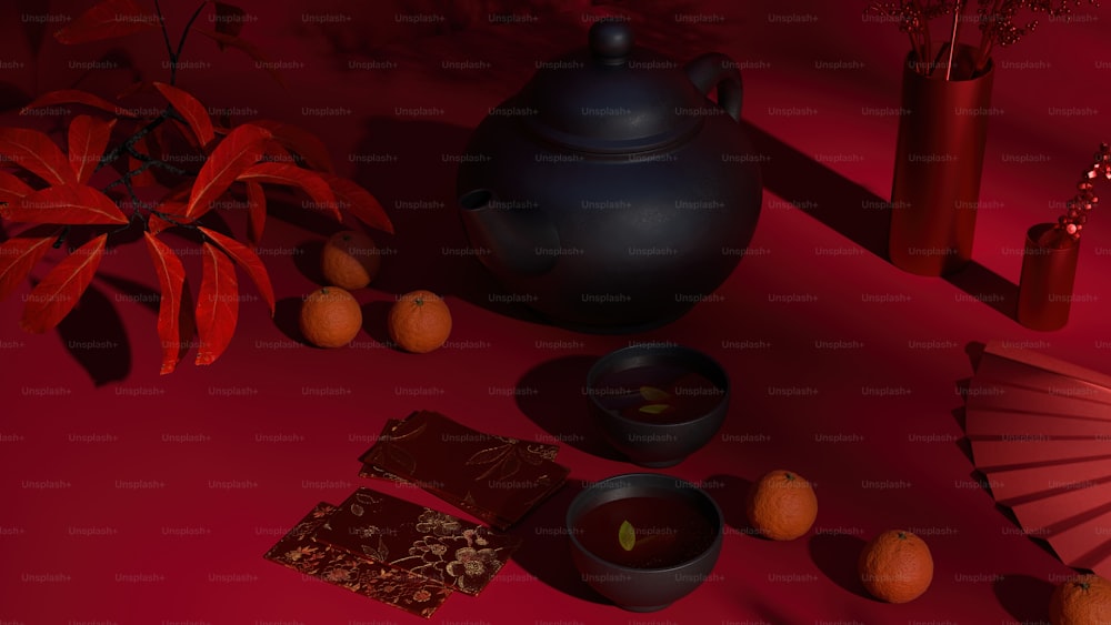 a tea pot, tea cup, and oranges on a red background