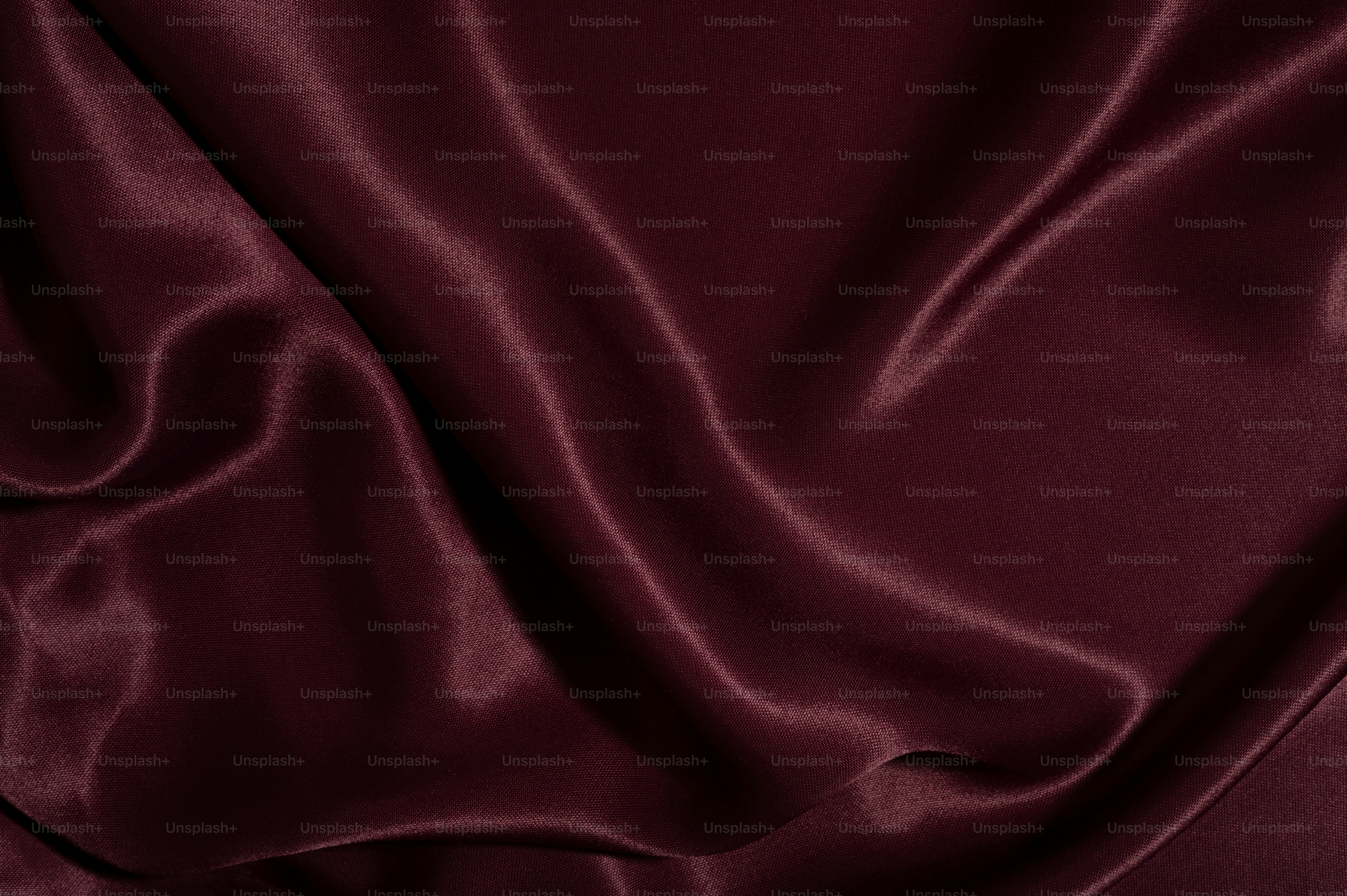 A close up view of a maroon fabric photo – Fabric Image on Unsplash