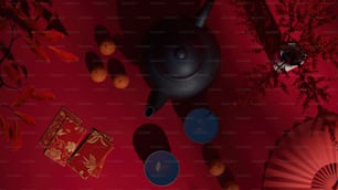 a red room with a black teapot and a red umbrella