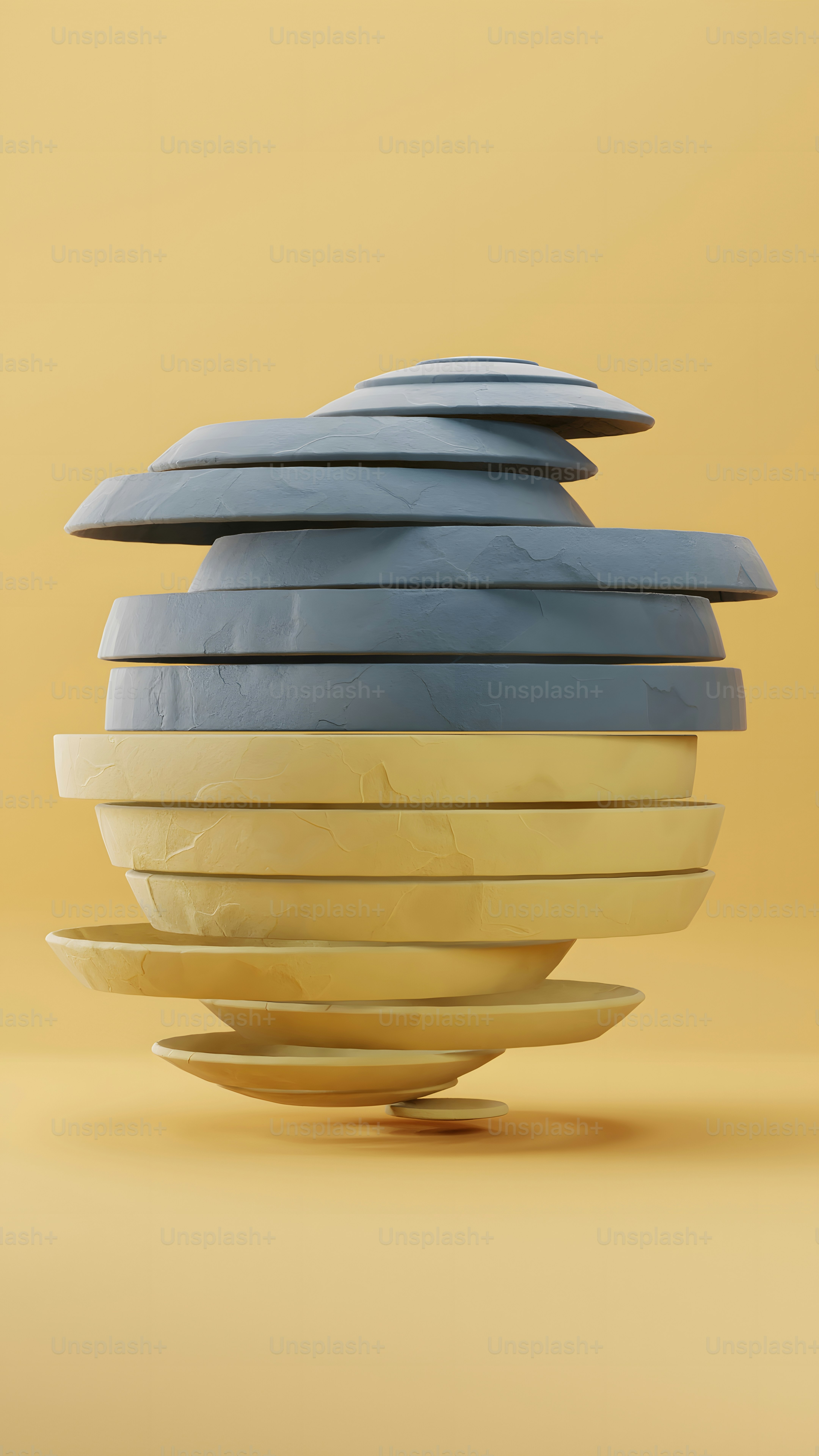 A stack of blue and yellow plates sitting on top of each other photo ...