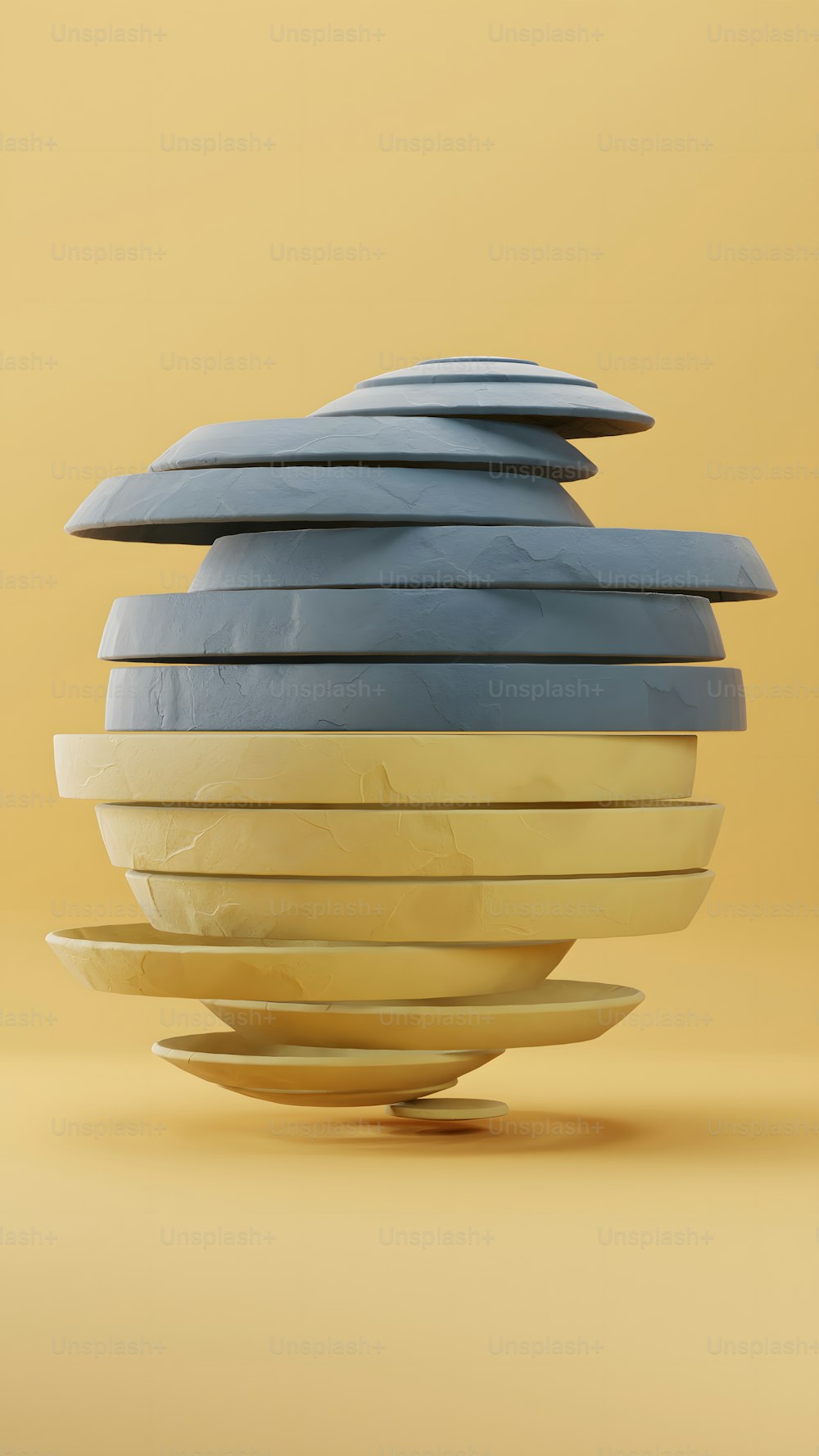 a stack of blue and yellow plates sitting on top of each other
