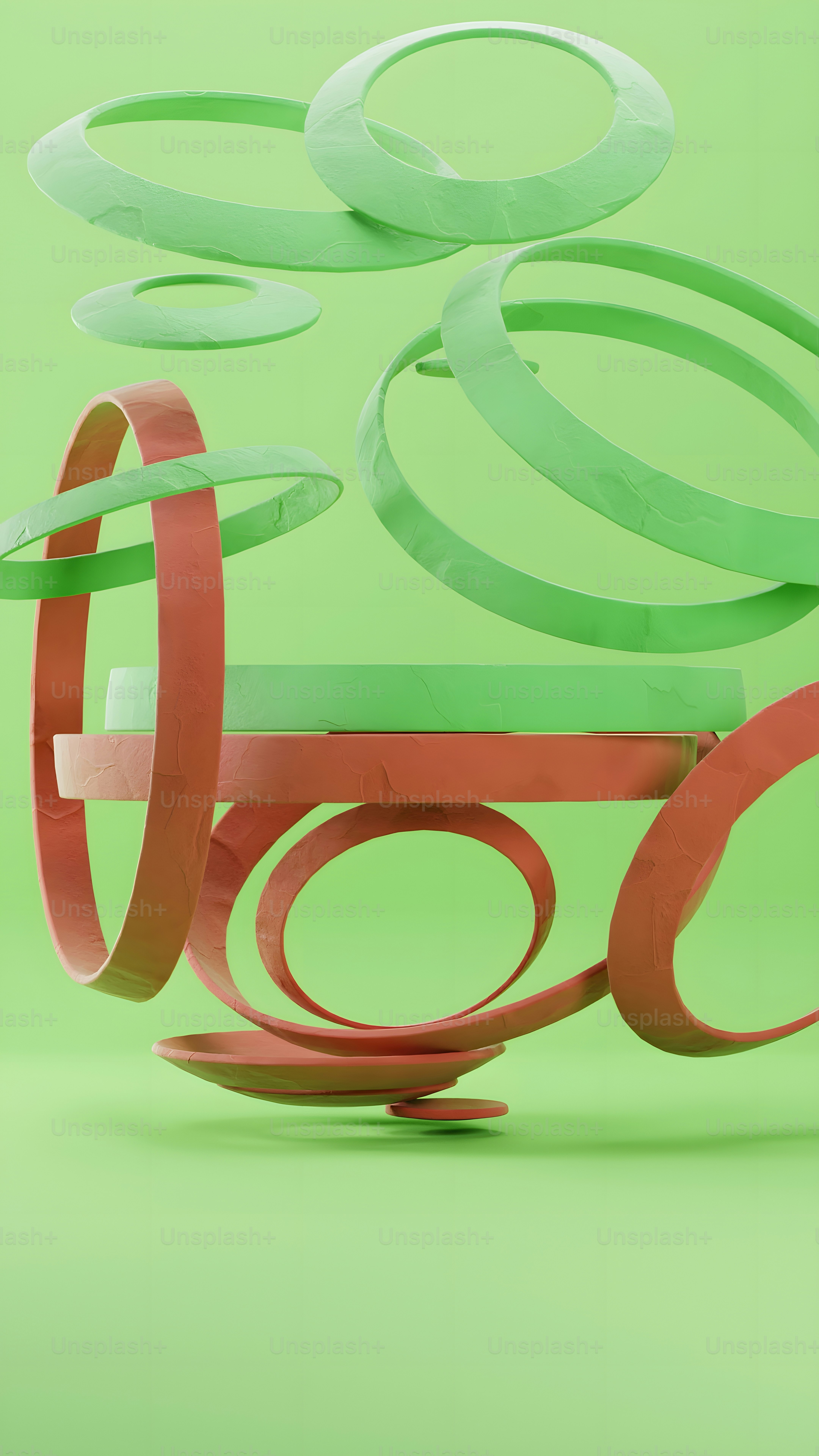 a green and red sculpture on a green background