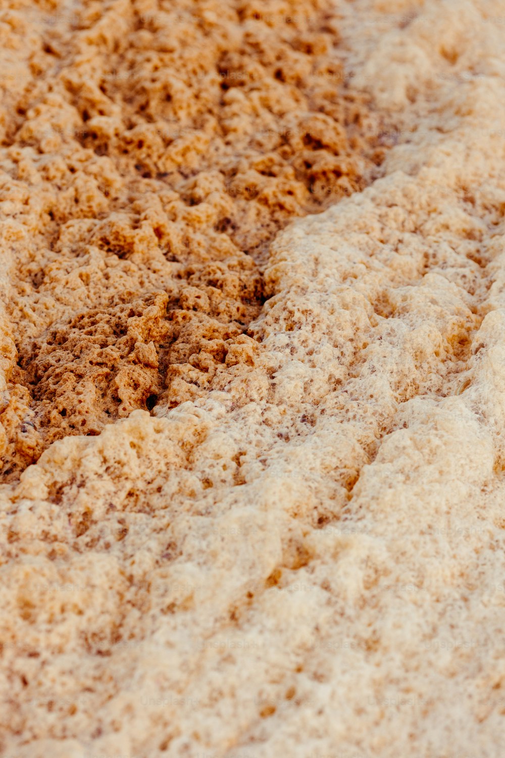 a close up of a brown substance on a white surface