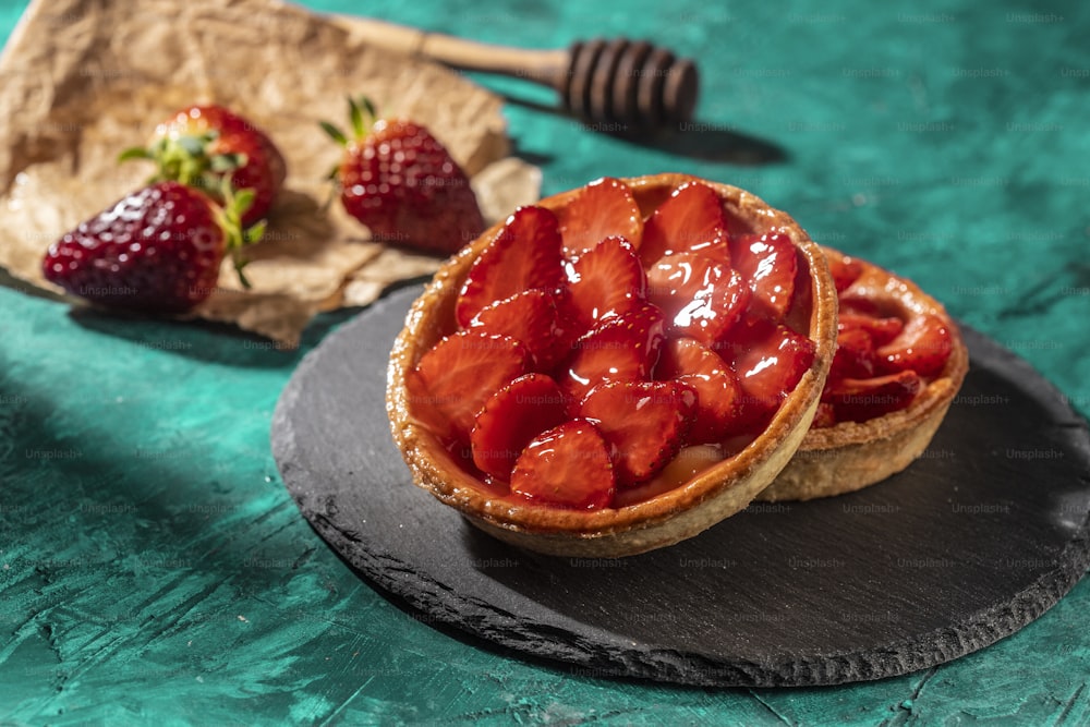 a pastry with strawberries on top of it on a plate