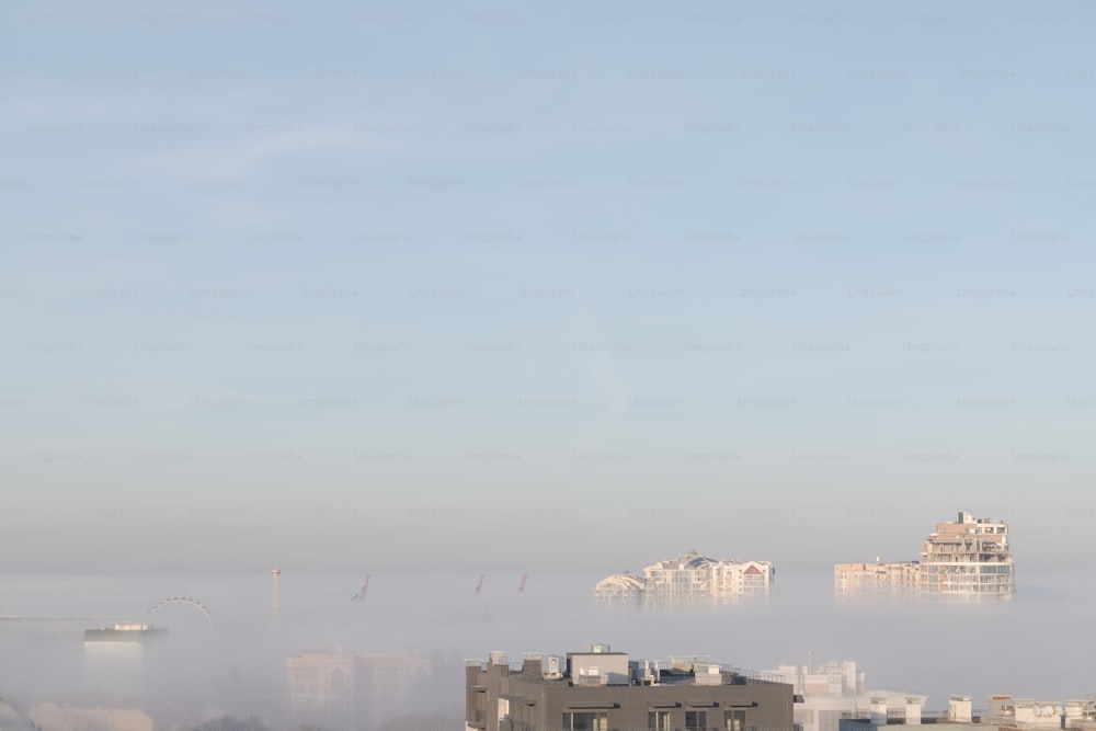 a view of a city in the fog