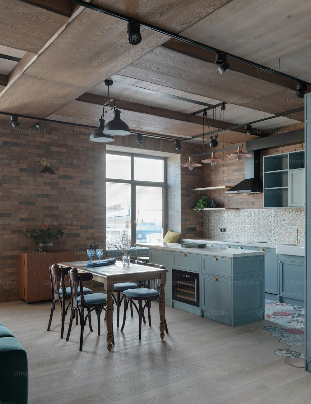 a kitchen with a table and chairs in it