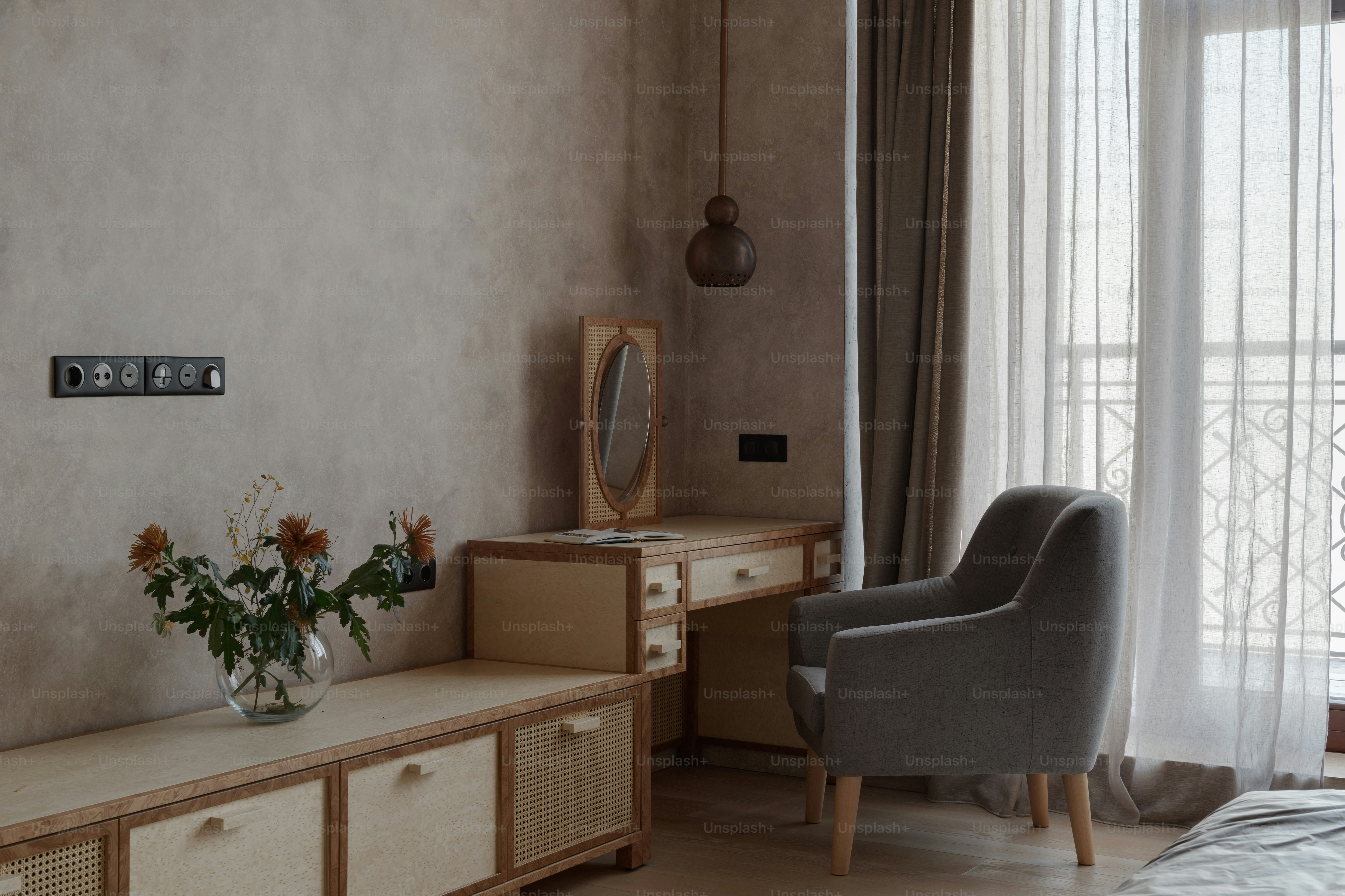 a bedroom with a bed, dresser, and chair