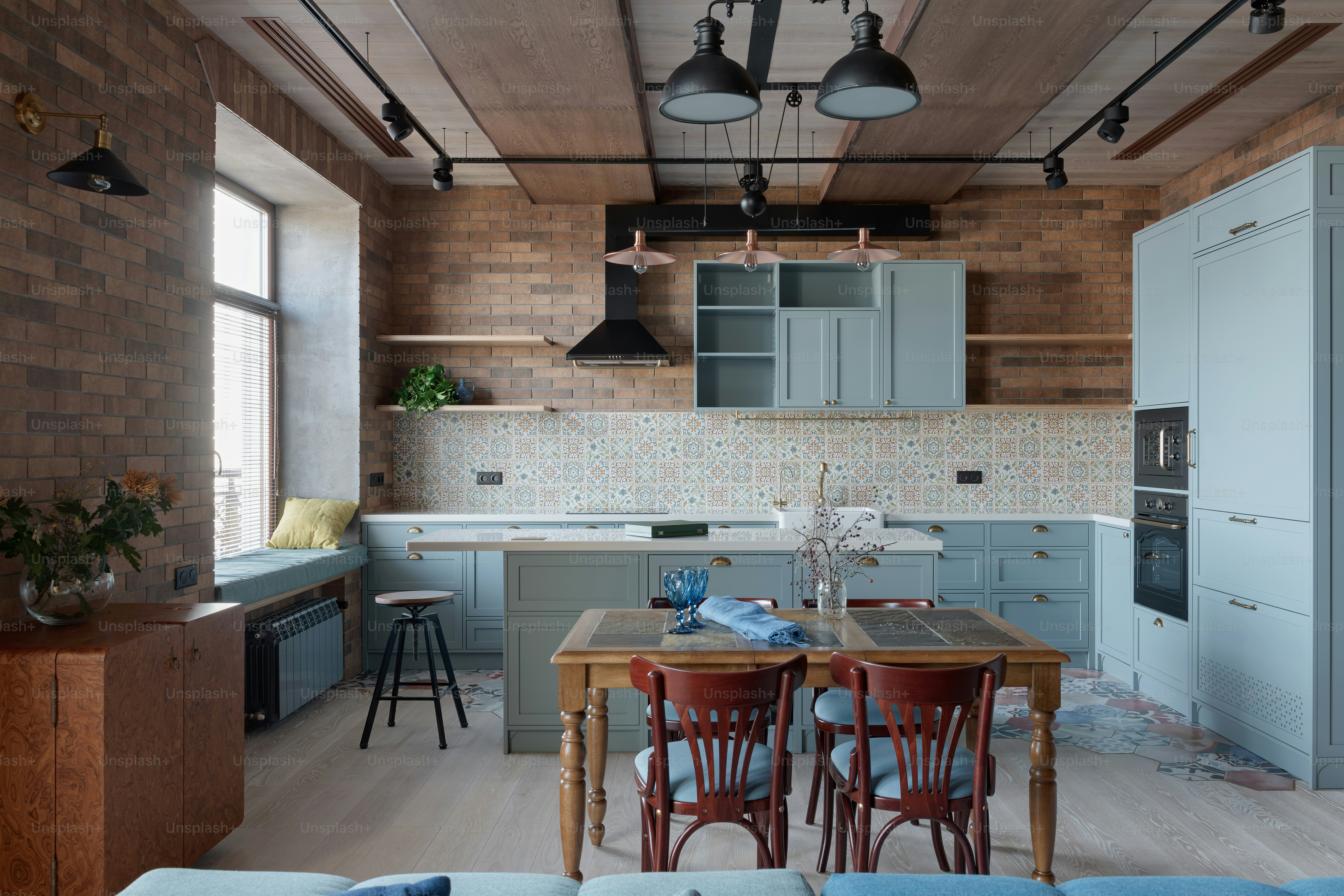 a kitchen with a table and chairs in it