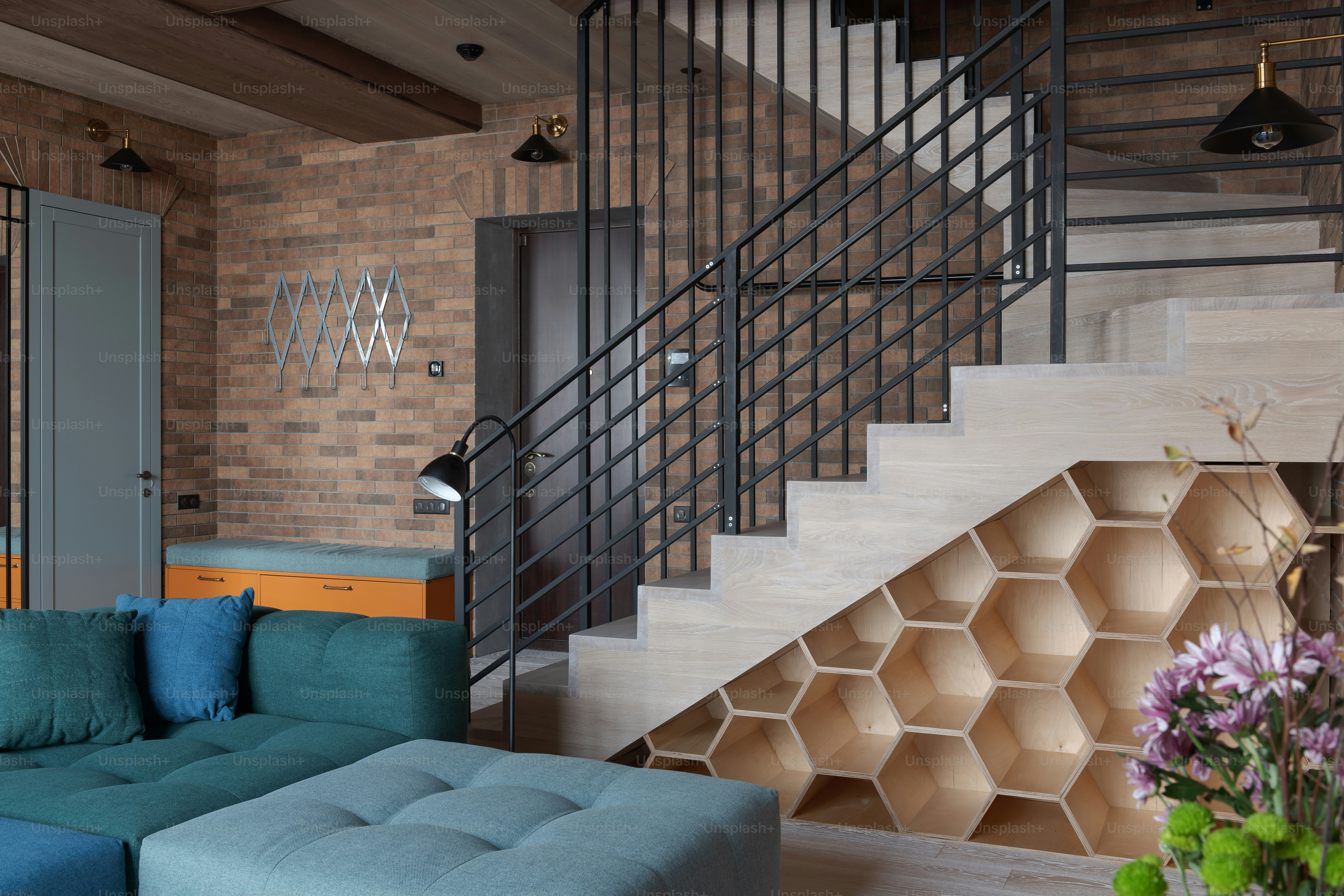 a living room filled with furniture and a stair case