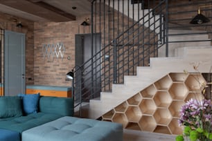 a living room filled with furniture and a stair case