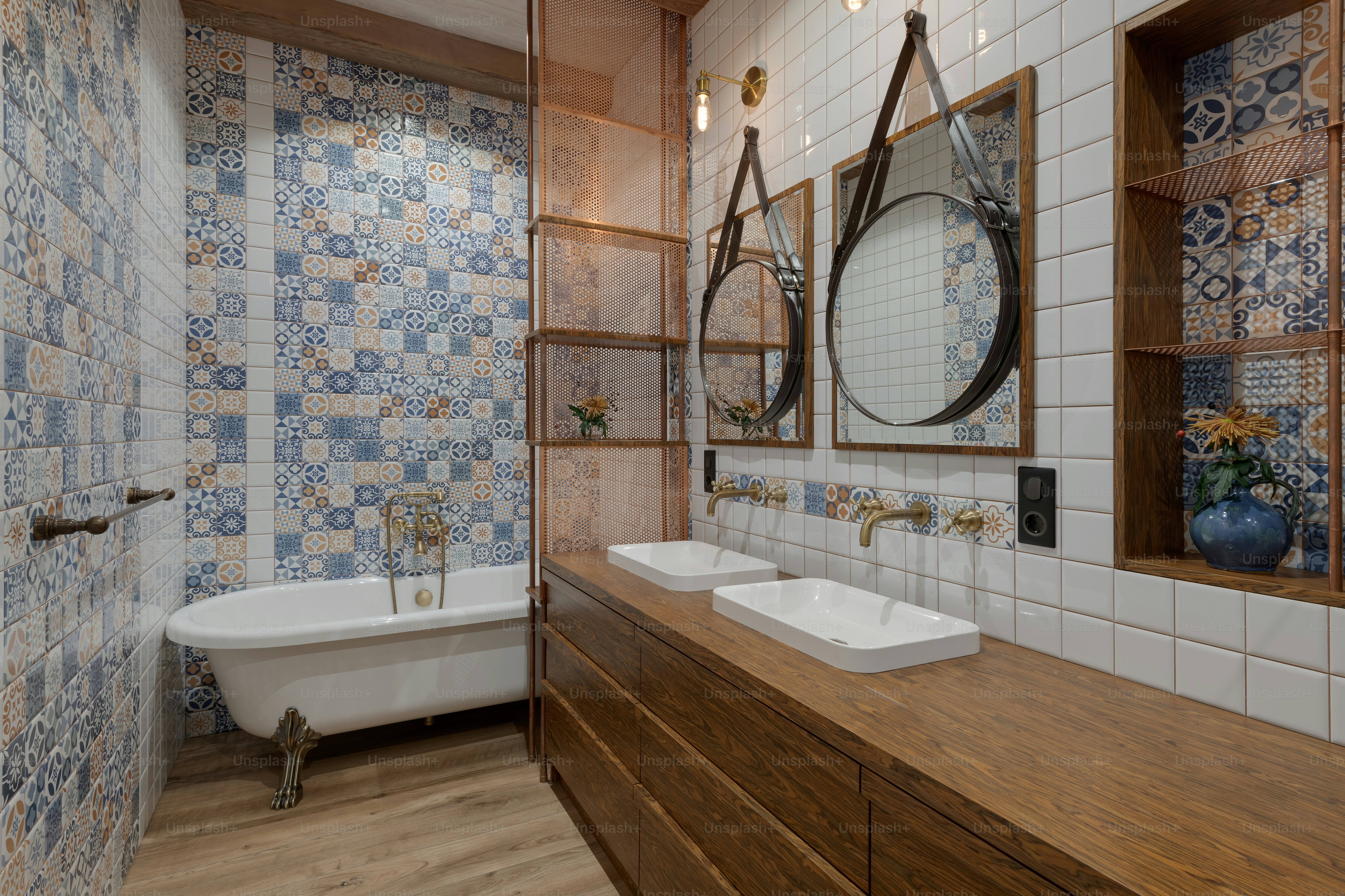 a bathroom with two sinks and a bathtub