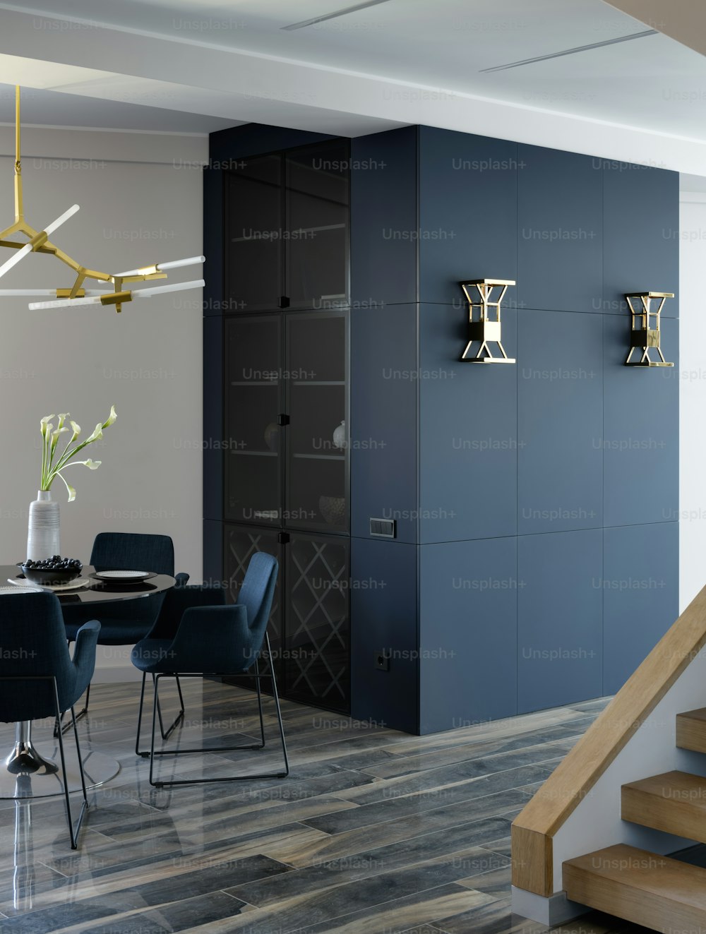 a dining room with blue chairs and a table