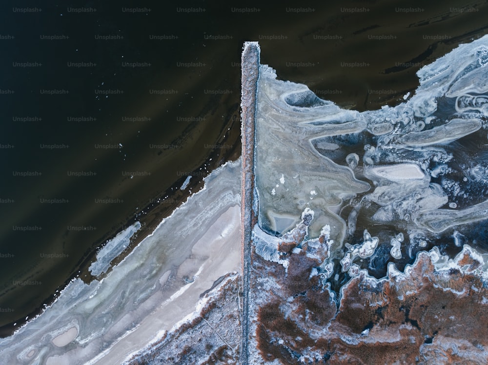 an aerial view of a body of water covered in ice