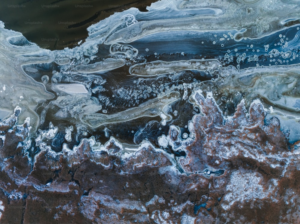 an aerial view of a body of water covered in ice