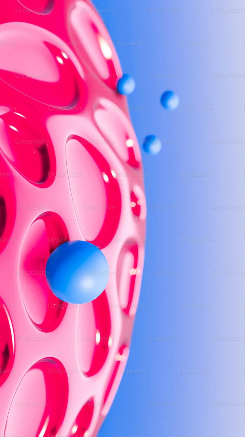 um objeto rosa e azul com um fundo azul