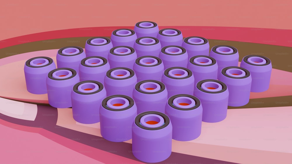a bunch of purple barrels sitting on top of a table