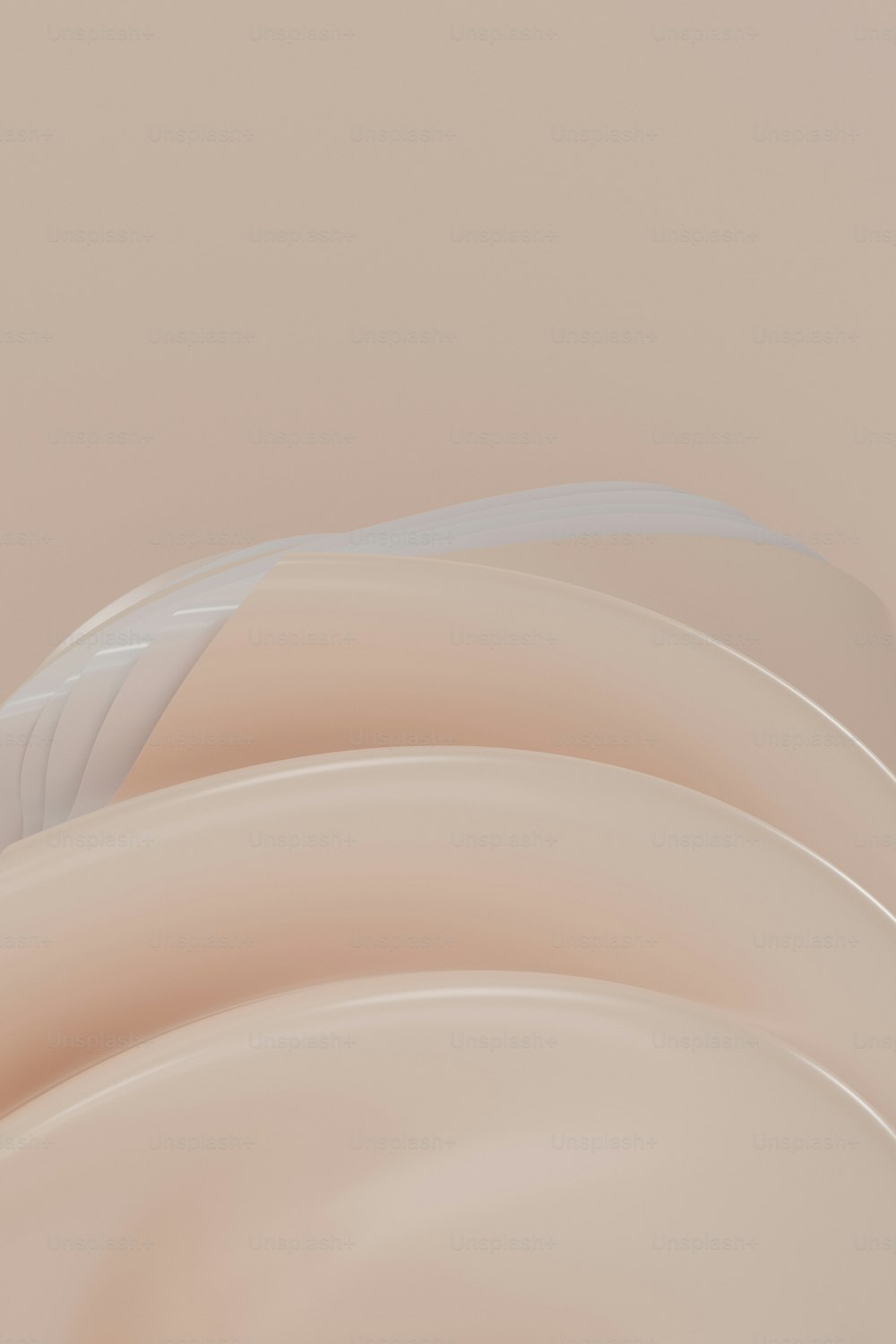 Una foto abstracta de un objeto beige curvo