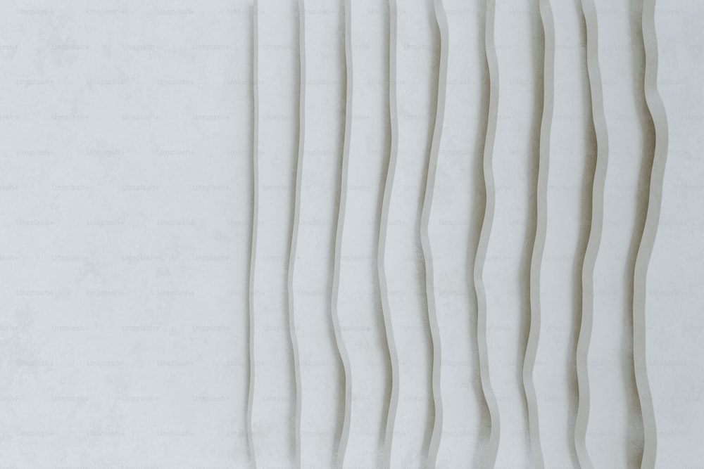 a white wall with wavy lines on it