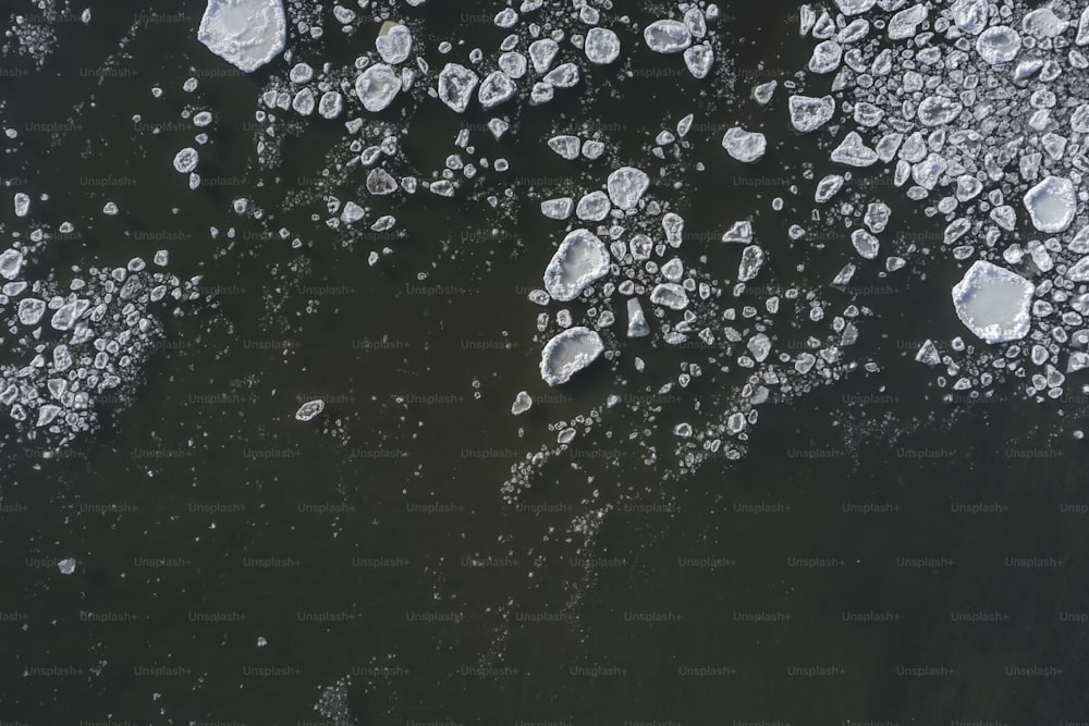 an aerial view of ice floes floating on the water