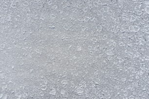 um close up de gotículas de água em uma superfície