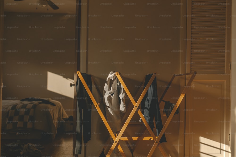 a folding chair sitting in a room next to a bed