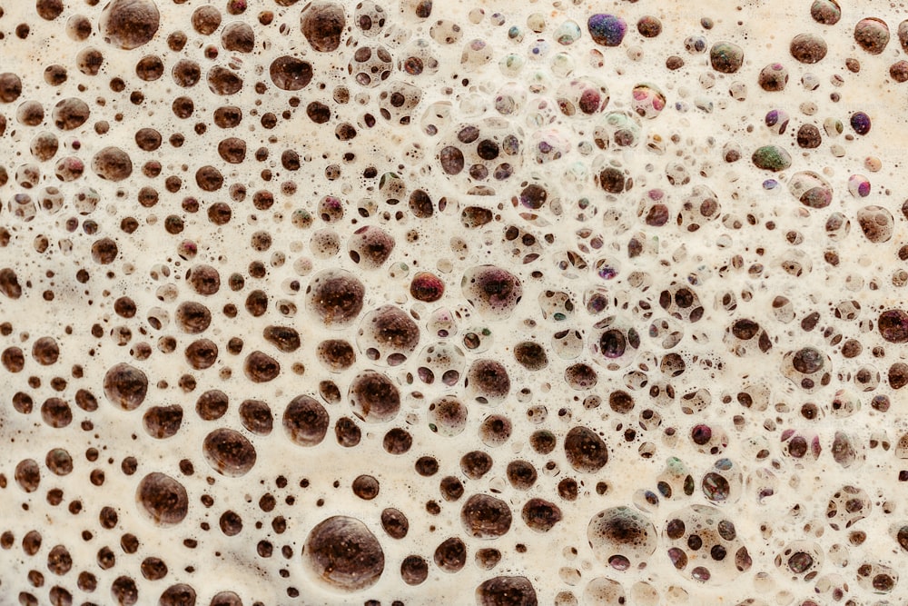 a close up of a wall with lots of holes in it