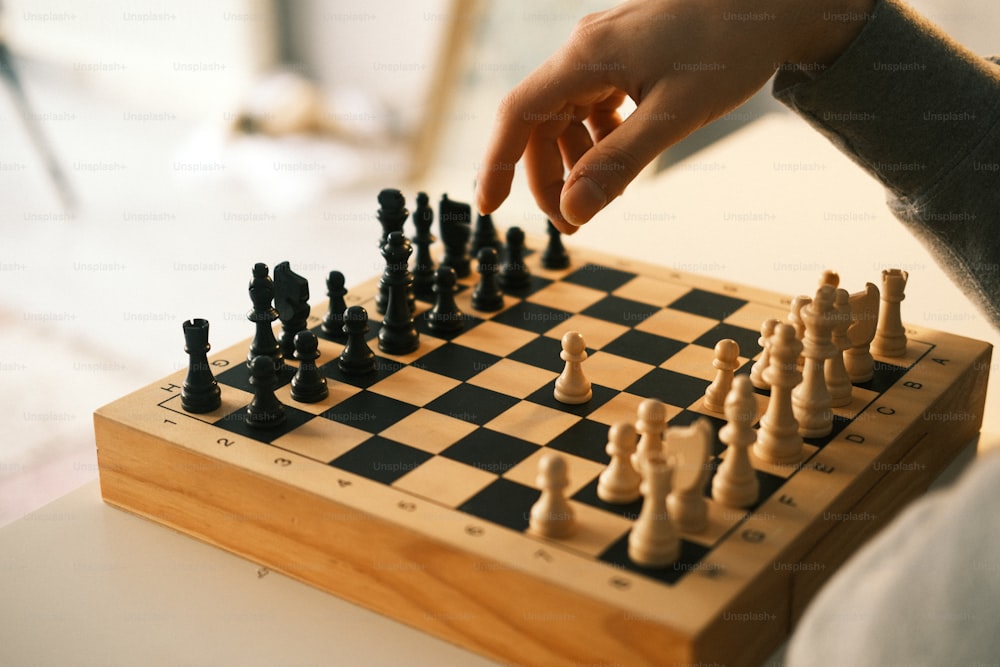 a person is playing a game of chess