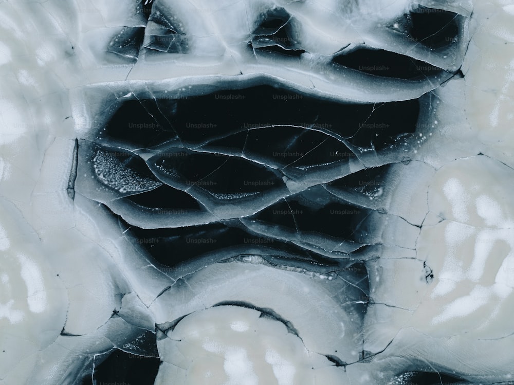 a black and white photo of ice and water