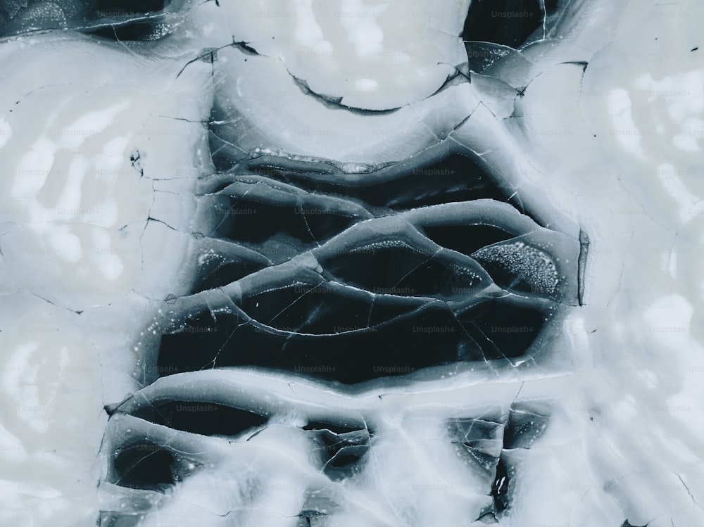 a black and white photo of ice and water