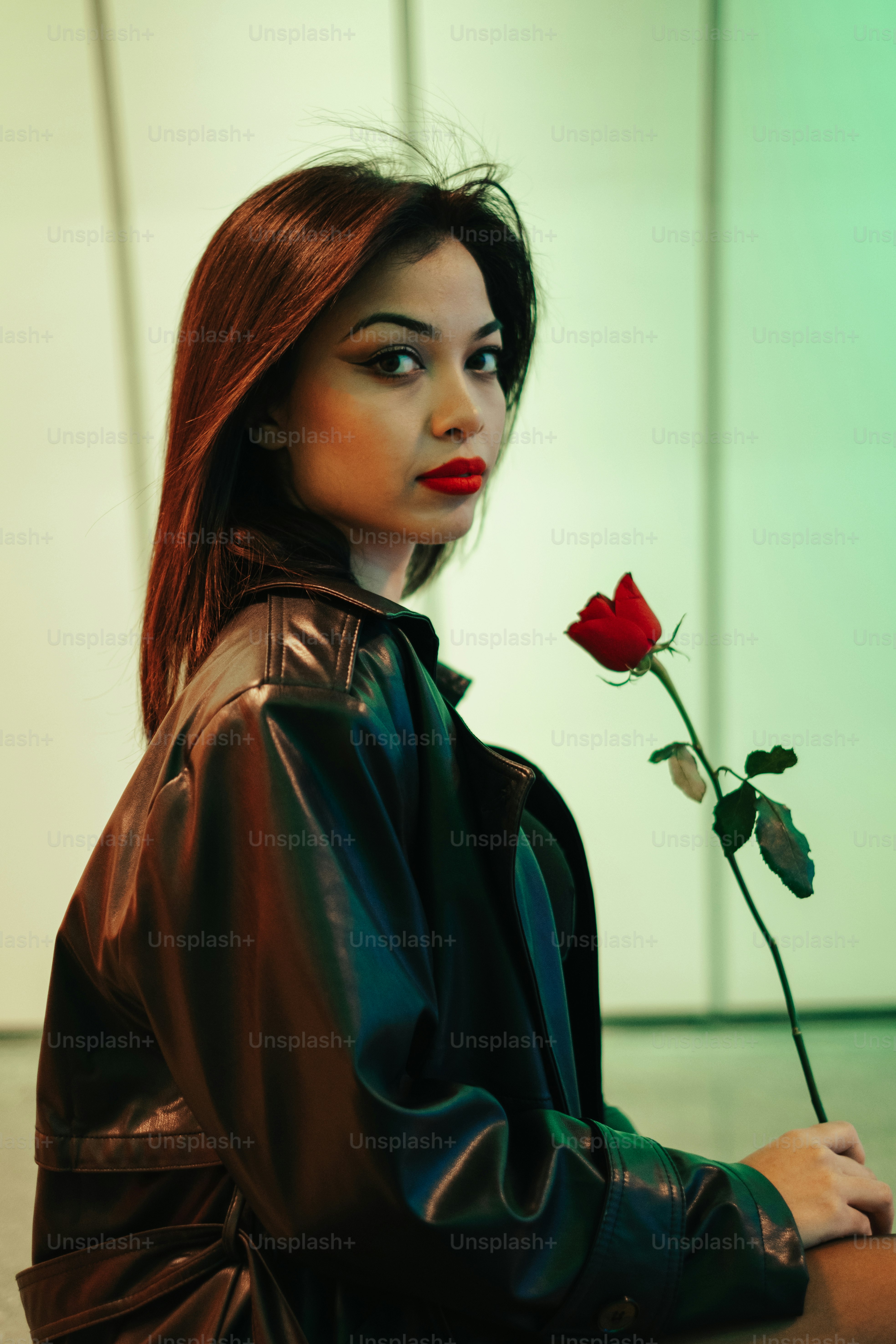 A woman with a red rose in her hand photo – Woman Image on Unsplash